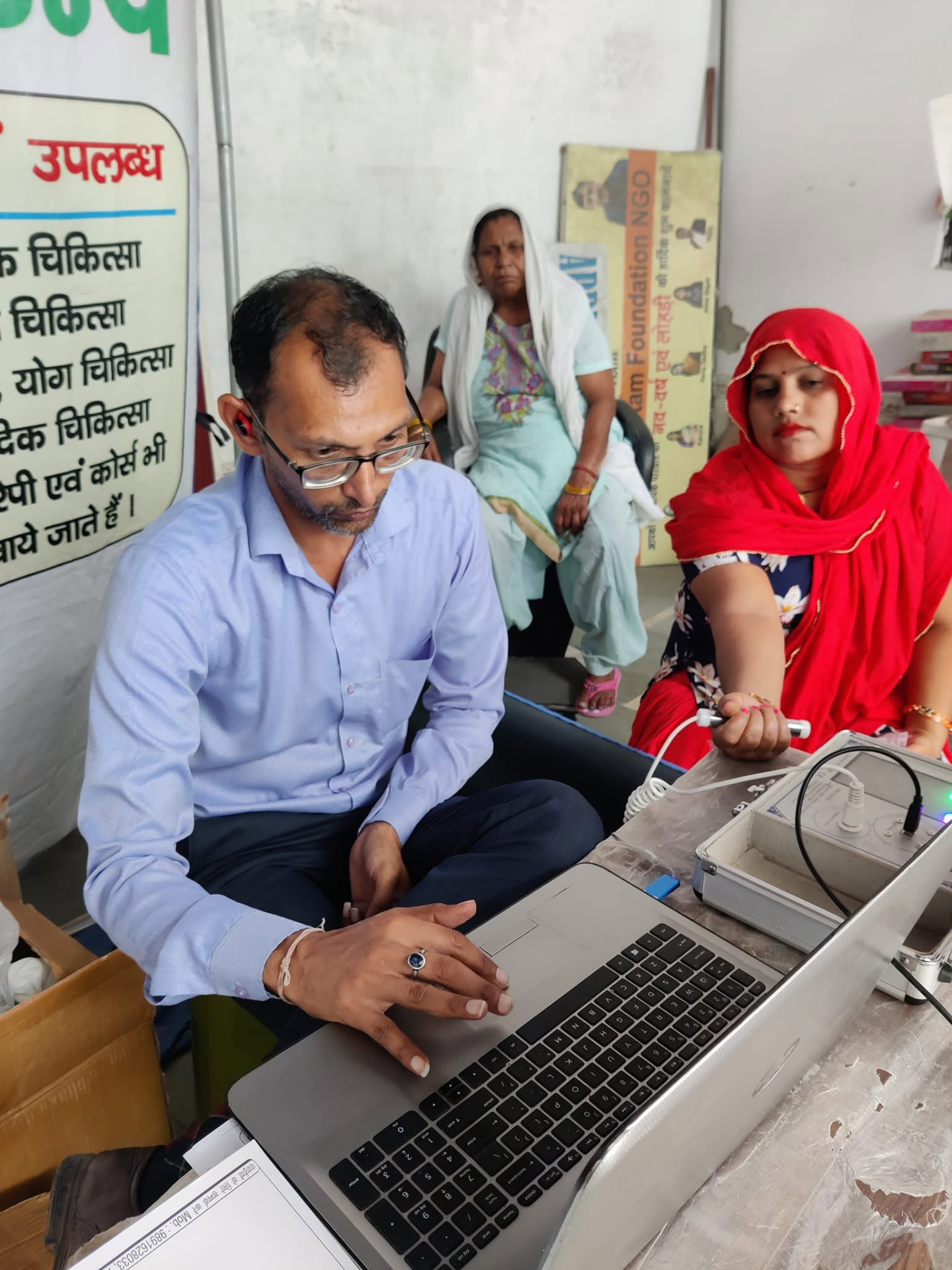 Woman taking a diagnostic test during a free community health screening camp