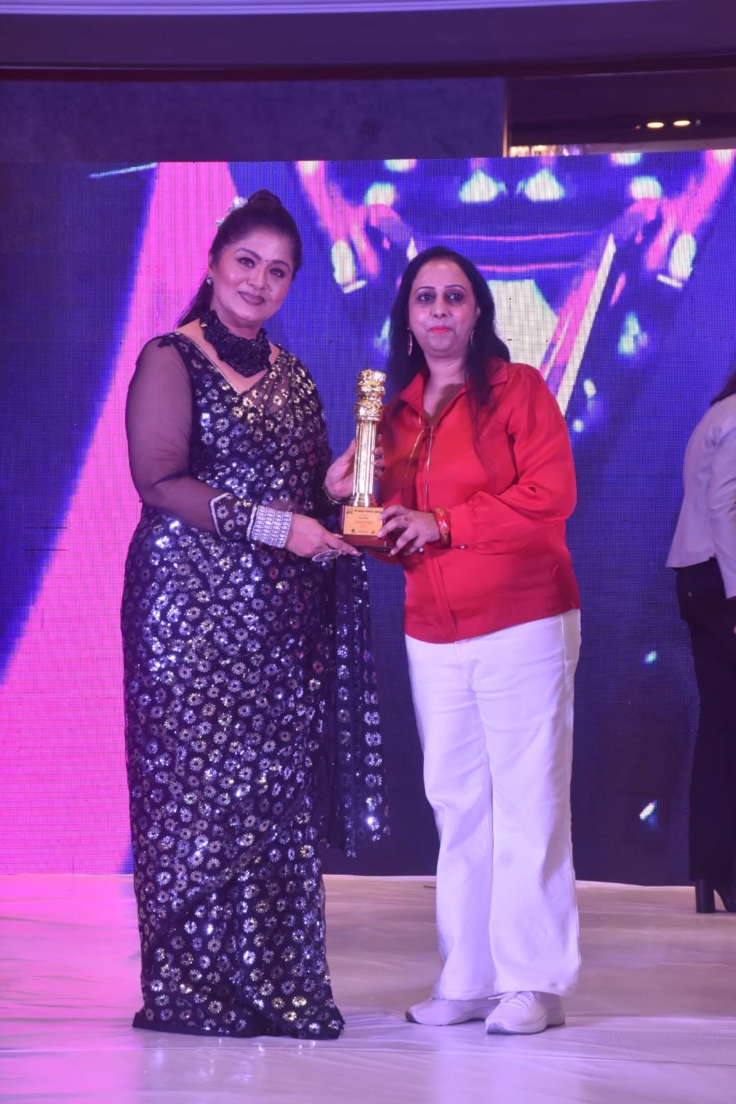 Foundation team receiving an award on stage