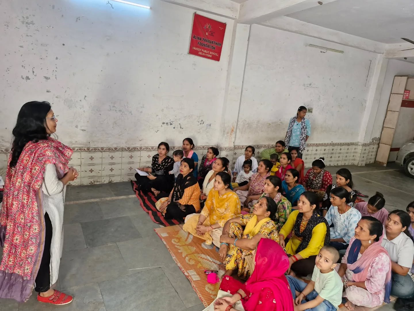 Community meeting at the Alina Parmartham Foundation centre in Dallupura